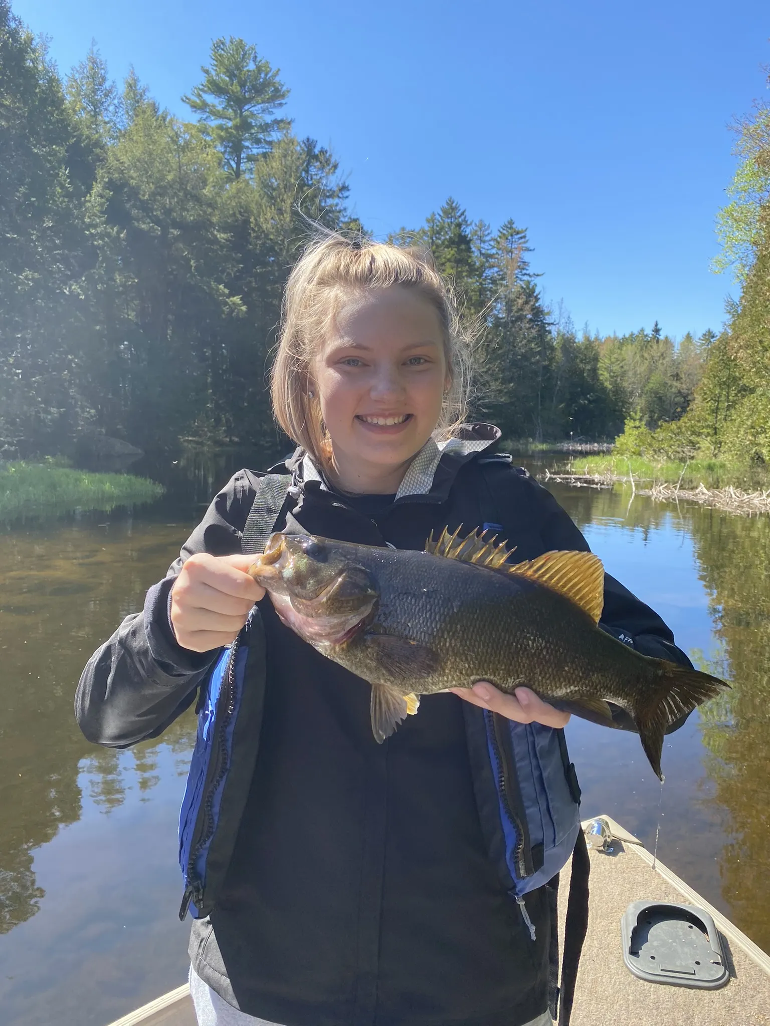 Maine fishing guide and angler holding brook trout
